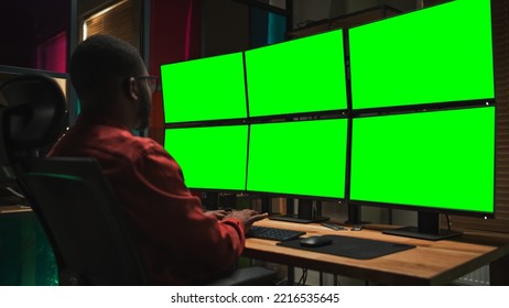 Black Cyber Security Specialist Coding on Desktop Computer With Six Monitors With Green Screen Chromakey. African American Male Contractor Monitoring Data Protection System For Private Sector. - Powered by Shutterstock - Get 15% off with code: PIKWIZARD15