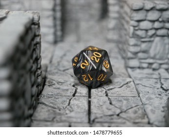 Black D20 Dice On 3D Printed Dungeon Tiles For D&D