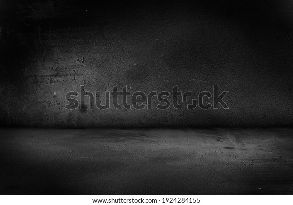 Black, dark and gray abstract cement wall and\
studio room , interior texture for display products. Room black\
floor is made of dark plaster for interior decoration or gym for\
exercise.