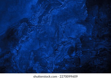Black dark navy blue texture background for design. Toned grain rough concrete surface. A painted old building wall with cracks. Close-up. Distressed, broken, crushed, collapsed, destruction. Arkistovalokuva