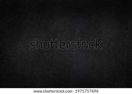 Black dark wall with vignetting and light spots. Minimalistic template for Halloween posters and banners