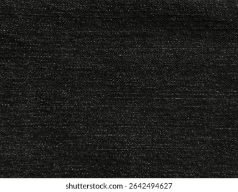 Black denim fabric texture. Textile background. Backgrounds used for designs and wallpapers