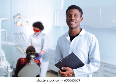 Black Dentist In A Dental Clinic