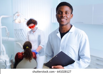 Black Dentist In A Dental Clinic