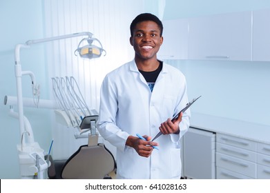 Black Dentist In A Dental Clinic