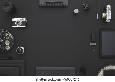 Black desk of photographer. Workspace on black table of a creative designer or photographer with laptop, tablet, cameras other objects of inspiration and copy space. Stylish home studio concept. - Powered by Shutterstock