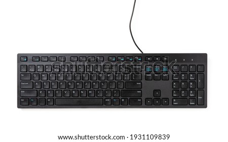 Black desktop computer keyboard isolated on white background. PC hardware device. Design element for distance learning, online business, working and shopping concepts. Top view.