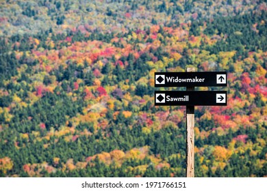 Black Diamond Ski Slopes Of Widowmaker And Sawmill With Direction Information Sign In Snowshoe, West Virginia At Allegheny Mountain Peak