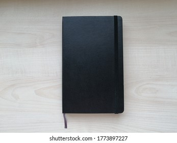 Black diary for notes and planning