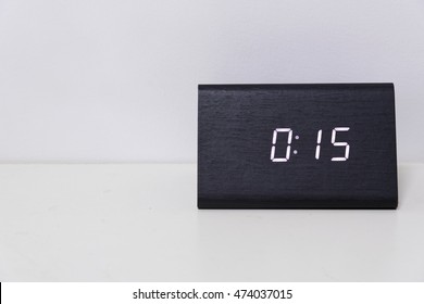 Black Digital Clock On A White Background Showing Time 00:15 (fifteen Minutes)