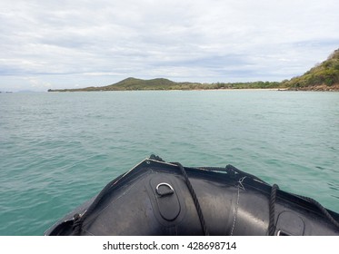 Black dingy boat in the sea