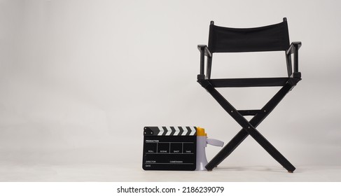 Black Director Chair And Black Clapper Board Or Movie Slate And Megaphone On White Background.No People	

