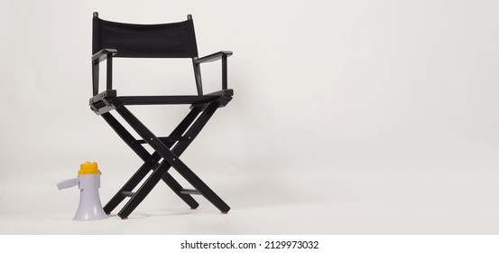 Black Director Chair And Megaphone On White Background.