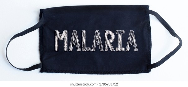 Black Disposable Protective Mask With MALARIA Text On Black Background.