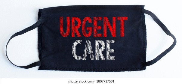 Black Disposable Protective Mask With URGENT CARE Text On Black Background.