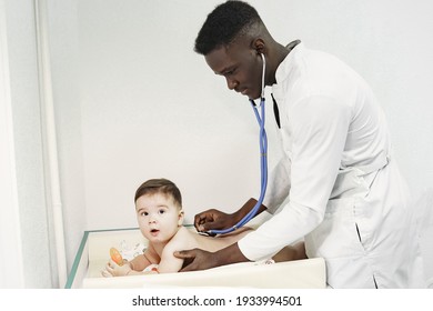 Black Doctor. Baby In Diaper. African With Stethoscope.