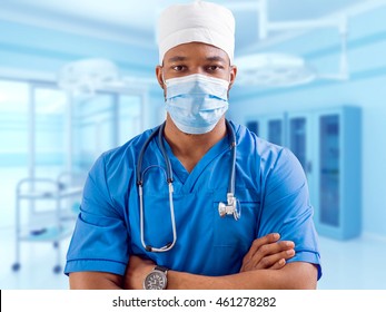 Black doctor in the clear surgical room. Light background