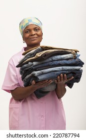 Black Domestic Worker Holding Laundry