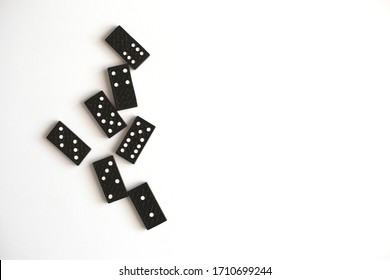 Black dominoes lie on a white background, top view. Board game. Place for text - Shutterstock ID 1710699244