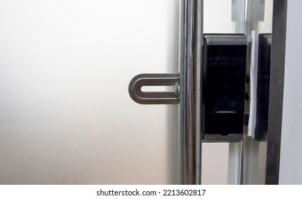 A Black Door Lock On An Opaque Glass Door