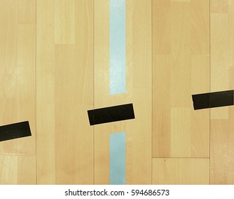 Black Dotted Lines In Hall Playground. Worn Out Wooden Floor Of Sports Hall With Colorful Marking Lines. School Gym Hall