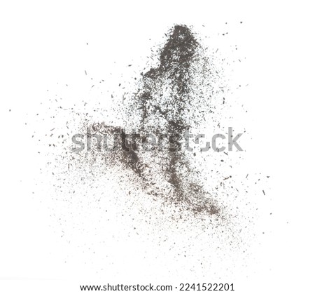 Black dried leave Tea explode. Small Fine size tea leaf flying explosion, Abstract cloud fly. Brown colored Teas splash throwing in Air. White background Isolated high speed shutter, throwing freeze