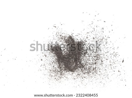 Black dried leave Tea explode. Small Fine size tea leaf flying explosion, Abstract cloud fly. Brown colored Teas splash throwing in Air. White background Isolated high speed shutter, throwing freeze