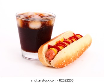 Black Drink And Hot Dog Over Lettuce Over White Background