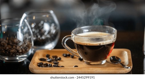 black drip coffee in glass cup, Barista making drip coffee by pouring spills hot water on coffee bean. Barista serve holding cup of hot black coffee or americano for serve on wooden table cafe shop - Powered by Shutterstock