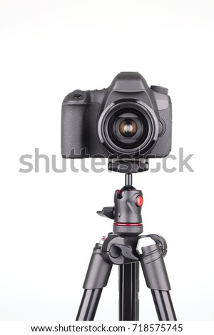 Black DSLR Camera on tripod isolated on white background