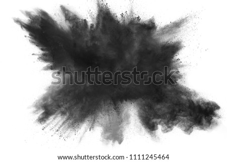 Black dust explosion on white background.