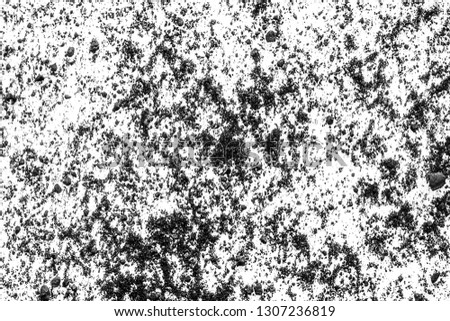 Black dust on a white background, abstract. Monochrome texture.