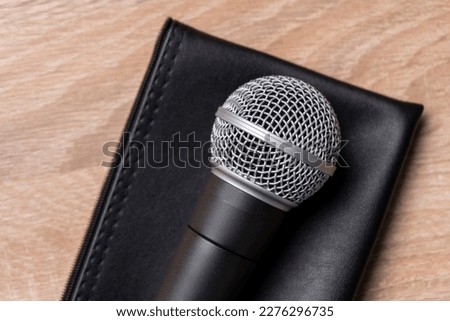 black dynamic microphone on black leather case  Stock photo © 