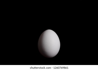 black egg lies on white background white egg lies on black background
