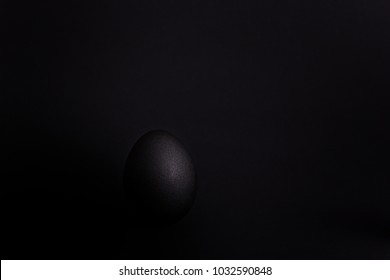 black egg on a black background
