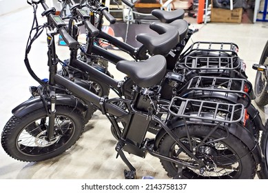 Black electric bicycles in a shop - Shutterstock ID 2143758137