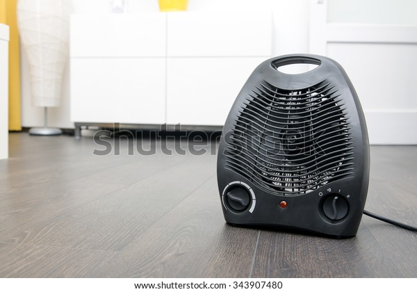 Black Electric Heater On Laminate Floor Stock Photo Edit