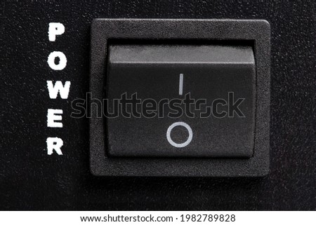 Black electronic On-Off switch front of power amplifier, stock image