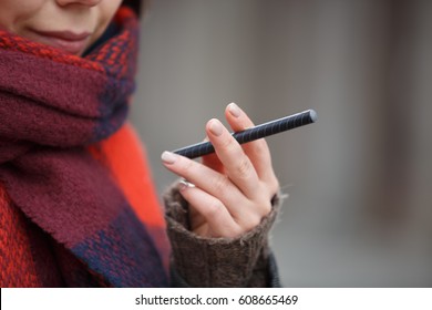 Black Electronic Vape Pen Device.Young Smiling Smoker Woman With E-cig Gadget In Hand.Quit Smoking Nicotine,start Vaping E-juice.Smoker Bad Habbit,health Abuse