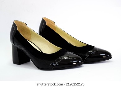 Black elegant shoe, isolated on white. Black female shoes. Women's black leather shoes. 