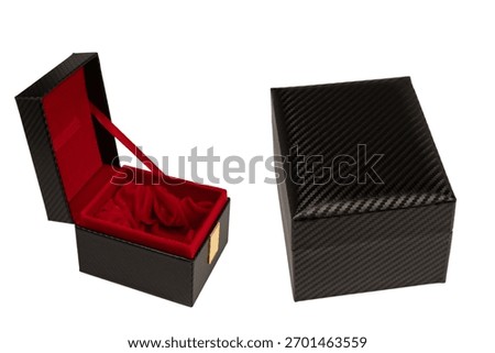 Black empty box covered with red velvet isolated on a white background. 