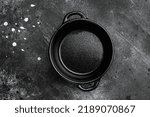 Black Empty clay pot set with copy space for text or food with copy space for text or food, top view flat lay, on black dark stone table background
