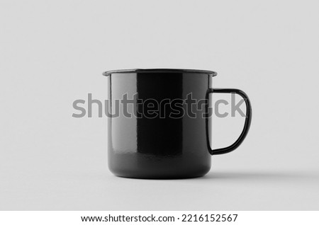 Black enamel mug mockup on a grey background.
