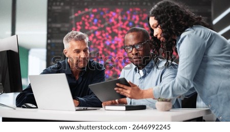 Black Engineer Using Laptop In Professional Cyber Security Team Office