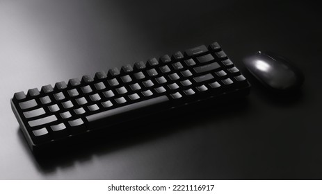Black ergonomic computer keyboard   computer mouse dark background  Wireless technology   gadgets  Minimalism  Diagonal  Copy space  Selective focus  Gradient