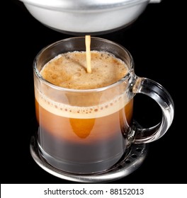 Black Espresso Coffee With Heady Froth In A Glass Mug Or Cup