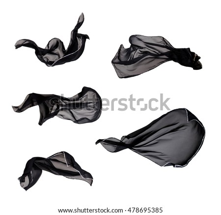Black Fabric Cloth Flowing on Wind, Textile Wave Flying In Motion. Isolated on White background