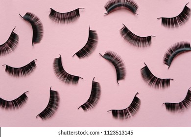 Black False Lashes Strips On Pink Background 