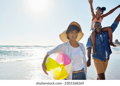 Black family, beach ball and summer at the beach while happy and walking together holding hands. Man, woman and a girl child excited about holiday at the ocean with freedom, happiness and fun outdoor - Powered by Shutterstock