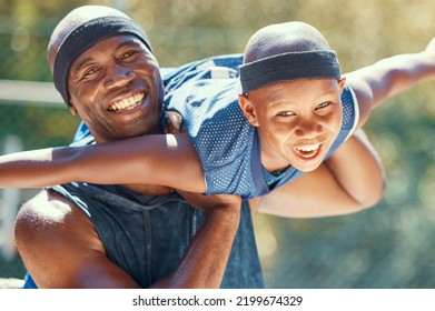 Black Family, Child Or Father On A Basketball Court While Having Fun And Playing Plane On A Sunny Day. Smile Portrait Of Happy And Excited Kid With Man Sharing A Special Bond And Close Relationship